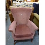 A comfortable armchair upholstered in pink Dralon on cabriole legs. WE DO NOT TAKE CREDIT CARDS OR