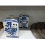 A pair of late 17th century Japanese blue and white porcelain square flasks, each side painted
