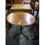 A George III mahogany wine table, the small oval top on a delicate turned column and tripod base. WE