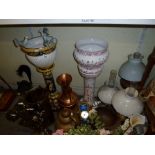 Two vintage brass and glass oil lamps plus another similar, pottery planters on stands, a brass