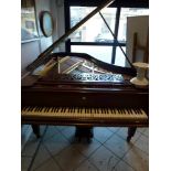 A Boudoir Grand Piano by Chappell of London in a rosewood case raised on square tapering legs with