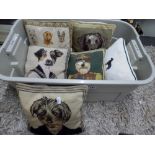 Six assorted scatter cushions depicting dogs, five of them in woolwork designs [box below rail top