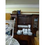 A 19th century oak and pine dresser the upper section with a pair of glazed doors flanking open