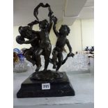 A bronze group of three dancing naked children after C. Petre, on black stone base, 15.5 in high [M]