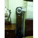 A mid 20th century grandmother clock by Smiths in an oak case with three-chain chiming movement