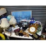 A mixed lot including a pair of table lamps, a table top globe, a vintage print of a city, a