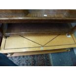 A very stylish 1980s coffee table, large, low and rectangular in bird's-eye maple with inlaid