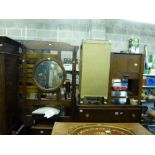 A furniture lot comprising an oak chest of six drawers, a Lloyd Loom bedside cabinet painted gold, a