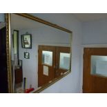 A rectangular gilt framed bevel-edged mirror WE DO NOT TAKE CREDIT CARDS OR CASH. STORAGE IS CHARGED