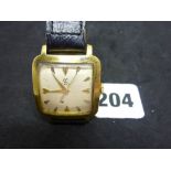 A stylish Cyma man's wrist watch in 18 ct gold, of rounded square form, on later black strap, weight