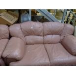 Two matching settees, one three the other with two seats in pink leather. WE DO NOT TAKE CREDIT