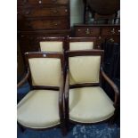 Four early 19th century French empire-style open armchairs in mahogany each with a smart modern