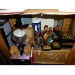 Eight Russian black lacquer boxes depicting various scenes, two decorative Russian eggs on stand,