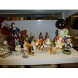 A mixed lot including a Carlton Ware Gollyband figurine, a Rupert the Bear figurine, Carlton Ware