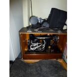 A cased Singer Sewing Machine No. EKO34844, a pair of cased Crown field binoculars 20x60 and a