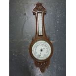 An Edwardian wooden framed barometer. [next to s70] WE DO NOT TAKE CREDIT CARDS OR CASH. STORAGE