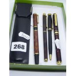 A French Waterman fountain pen, with 18 ct gold nib, in mottled brown lacquer case; a slim