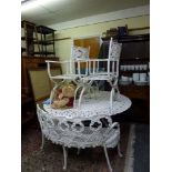 A pretty painted aluminium circular garden table with pierced edge decoration and four ornate