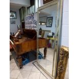 A large impressive floor-standing silver double framed mirror with bevelled glass WE DO NOT TAKE