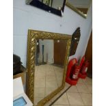 A large rectangular gilt deep framed bevel-edged mirror decorated with leaves WE DO NOT TAKE