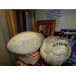 A signed football and signed rugby ball, a snooker scoring board, an Old Trafford mirror, a quantity