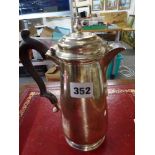 A good George V silver reproduction hot-water pot with wood handle by D. & J. Wellby, London 1922,