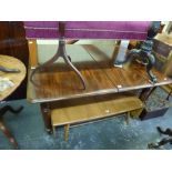 A fine quality 19th century mahogany dining table extending with two leaves and raised on turned