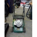 A Briggs & Stratton 675 series EX Atco Quattro petrol lawnmower [back door] WE DO NOT TAKE CREDIT