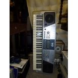 A Rock Jam RJ661 electric piano on stand [end of third aisle] WE DO NOT TAKE CREDIT CARDS OR CASH.