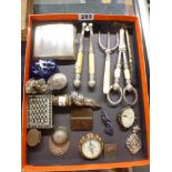 An attractive selection of small items, including: silver cigarette case, modern jockey cap caddy