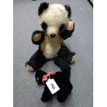 Two vintage stuffed toys including a Chiltern Toys black and white mohair panda, approximately 10 in