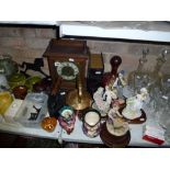 A mixed lot included a wooden cased mantel clock, four Leonardo figurines on wooden bases, a