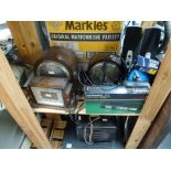 A mixed lot including three wooden 1930s mantel clocks, a box of shells, a small wooden barometer,