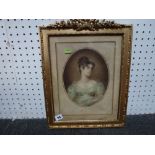 An oval coloured mezzotint portrait of a young woman, in a highly decorative gilt frame and a