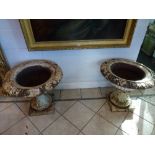 An impressive pair of Victorian cast iron planters in the classical form on stands (diameter 24 in x