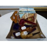 Three good quality pipes, two in boxes, one a Meerschaum with silver mounts, a smokers pouch and a