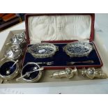 A good George V silver double condiment set, with blue glass liners, five silver condiment spoons