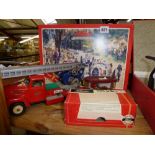 Three Schuco model vehicles including a tinplate truck, a limited edition Studio II Bausatz and