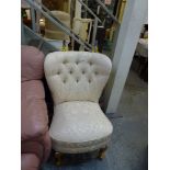 A charming bedroom chair upholstered in buttoned cream fabric on cabriole legs. WE DO NOT TAKE