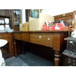 A 19th century mahogany hunt table combining a small, long flap above three frieze drawers, raised