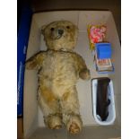 A vintage mohair teddy bear with articulated limbs, 13 in approximately, and a few pieces of plastic