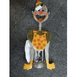 A large novelty corkscrew and bottle opener styled as a cartoon character, the body with a polka dot