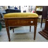 A good quality Edwardian piano stool with marquetry frame and storage seat on square tapering
