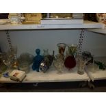 Two shelves of glassware including a large End of Day glass fish, a dessert service, vintage