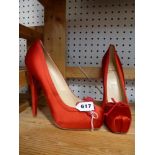 A pair of red satin Christian Louboutin Lolo ballet pumps with bow, marked 39 [upstairs shelves]