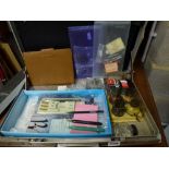 A document case containing calligraphy pens and inks and a box of educational instruction books.