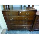 A George III oak chest of two short over three long graduated drawers on bracket feet. WE DO NOT