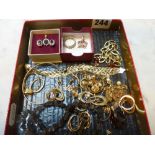 A quantity of 9 ct gold, comprising: a charm bracelet, a woven bracelet, a bangle, Clogau dragon