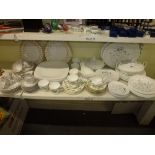 A Wedgwood white and silver patterned part dinner service decorated with flowers approximately 40