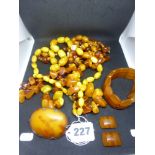 Three vintage amber necklaces, variously of polished oval and globular beads and of polished